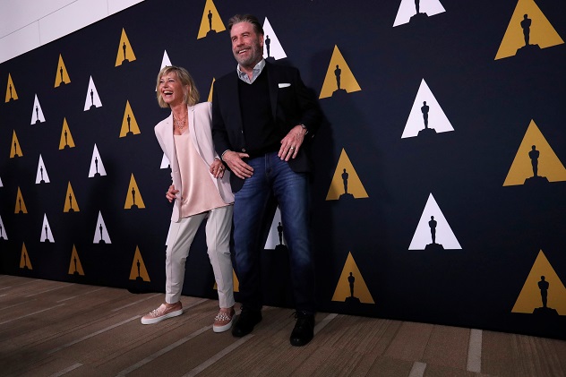 Cast members John Travolta and Olivia Newton-John dance at a 40th anniversary screening of "Grease" at the Academy of Motion Picture Arts and Sciences in Beverly Hills, California, U.S., August 15, 2018. REUTERS/Mario Anzuoni