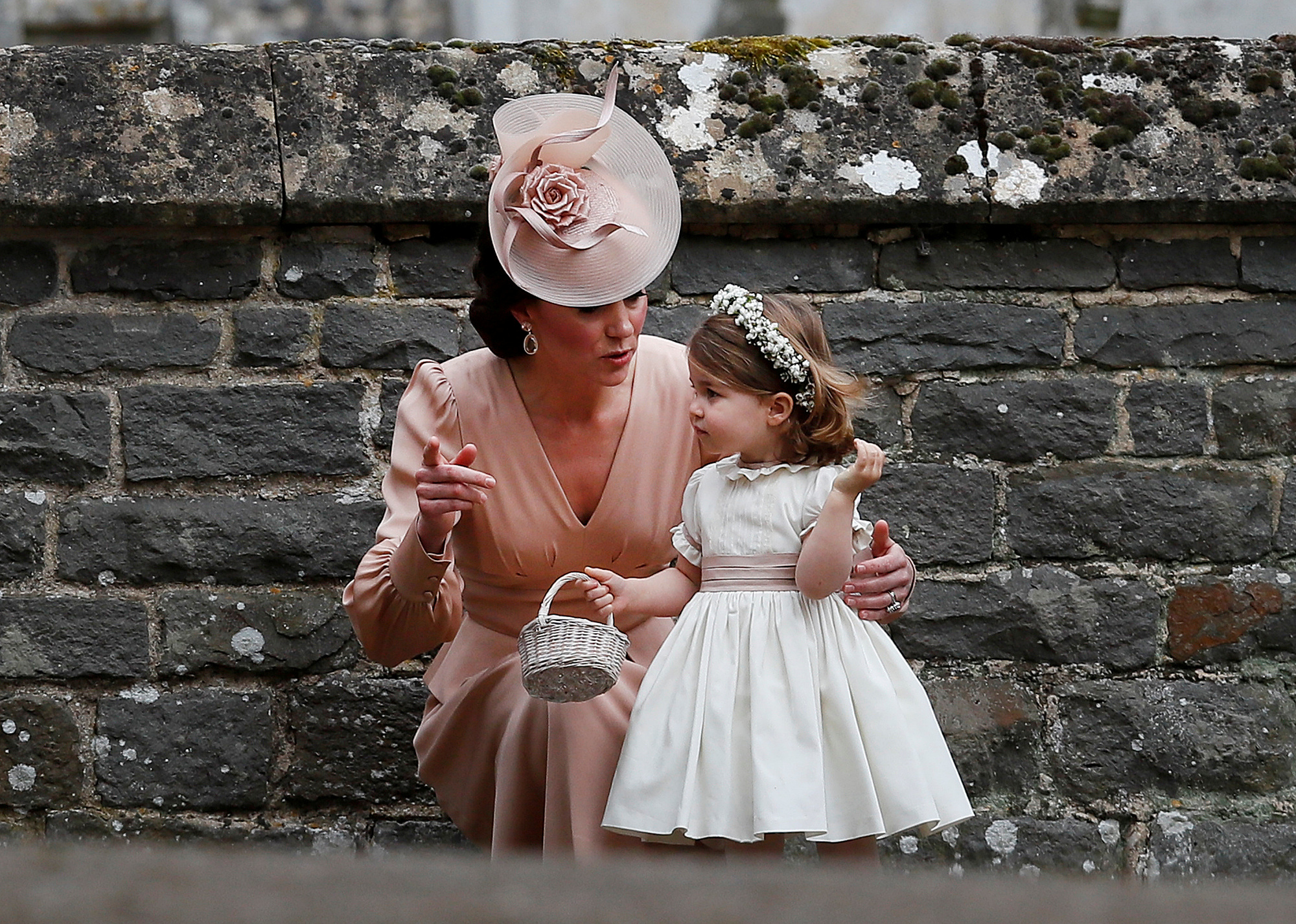 Britain's Catherine, Duchess of Cambridge stands with her daughter Princess Charlotte, a bridesmaid, following the wedding of her sister Pippa Middleton to James Matthews at St Mark's Church in Englefield, west of London, on May 20, 2017.    REUTERS/Kirsty Wigglesworth/Pool     TPX IMAGES OF THE DAY - RC1F573DD930