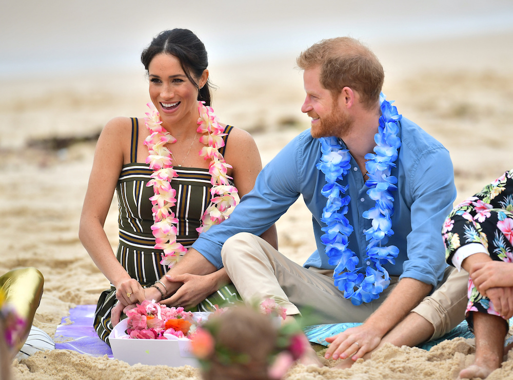 Britain's Prince Harry and Meghan, Duchess of Sussex on Bondi Beach during their visit to Sydney on the fourth day of the royal couple's visit to Australia.Friday October 19, 2018.  Dominic Lipinski/Pool via REUTERS - RC1CEDFDDFA0