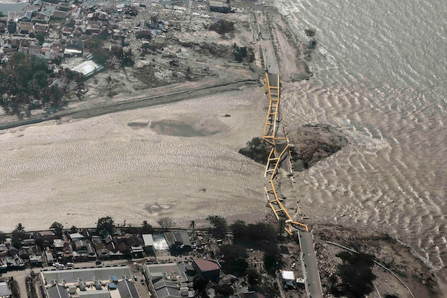 An aerial view shows bridge damaged by an earthquake and tsunami in Palu, Central Sulawesi, Indonesia September 29, 2018. Antara Foto/Muhammad Adimaja via REUTERS
