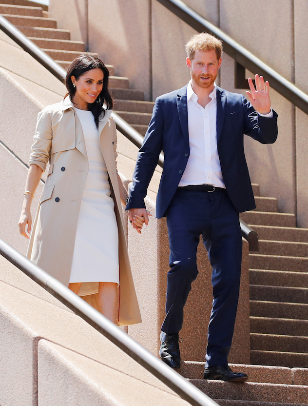 Britain's Prince Harry waves next to wife Meghan, Duchess of Sussex during a visit at the Sydney Opera House in Sydney, Australia October 16, 2018. REUTERS/Phil Noble - RC18EEF32D10