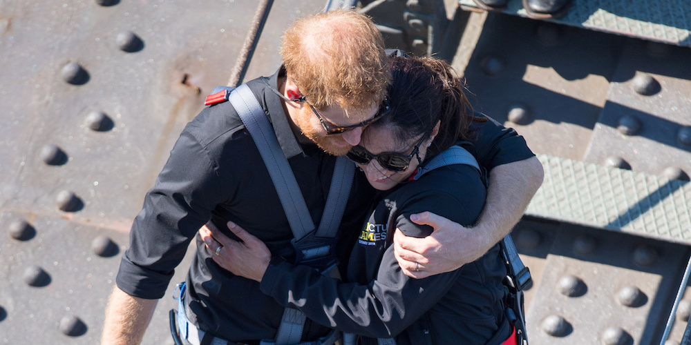 Britain's Prince Harry, the Duke of Sussex hugs Gwen Cherne during a visit to the Sydney Harbour Bridge with Prime Minister of Australia Scott Morrison and Invictus Games competitors on the fourth day of the Duke and Duchess of Sussex's visit to Australia, Thursday October 18, 2018. Dominic Lipinski/Pool via REUTERS