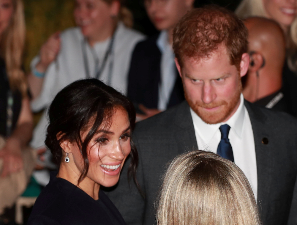 Britain's Prince Harry and Meghan, Duchess of Sussex, attend a reception at the Opera House's Bennelong Restaurant before the opening ceremony of the 2018 Invictus Games, in Sydney Australia October 20, 2018. Ian Vogler/Pool via REUTERS - RC1B413875D0