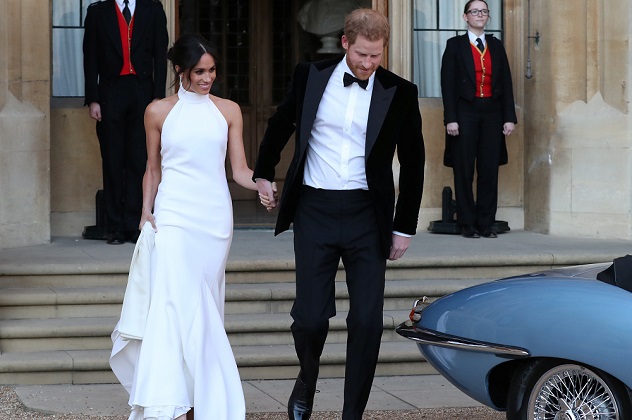The newly married Duke and Duchess of Sussex, Meghan Markle and Prince Harry, leaving Windsor Castle after their wedding to attend an evening reception at Frogmore House, hosted by the Prince of Wales Windsor, Britain, May 19, 2018.  Steve Parsons/Pool via REUTERS 