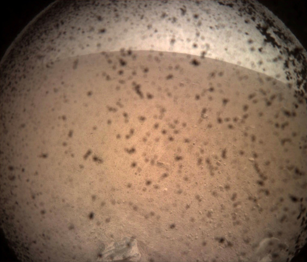 NASA's InSight Mars lander acquired this image of the area in front of the lander using its lander-mounted, Instrument Context Camera (ICC) with the ICC image field of view of 124 x 124 degrees, on Mars, November 26, 2018.    NASA/JPL-Caltech/Handout via REUTERS  