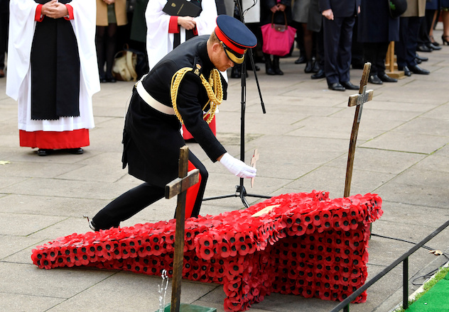Britain's Prince Harry, the Duke of Sussex, lays a cross at the Field of Remembrance at Westminster Abbey in London, Britain, November 8, 2018. REUTERS/Toby Melville