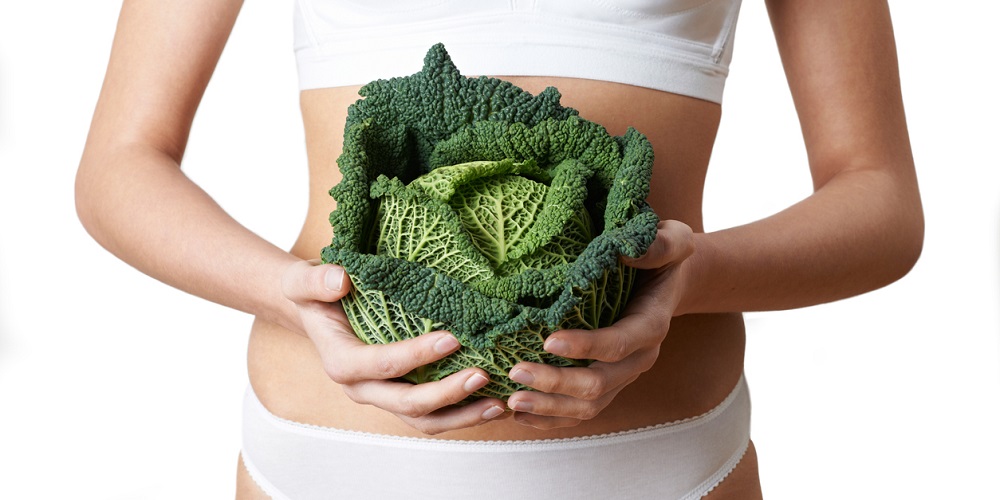 Close Up Of Woman In Underwear Holding Cabbage