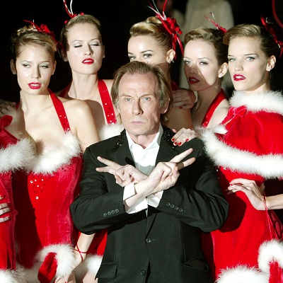 BILL NIGHY AND A GROUP OF MODELS DRESSED IN SANTA OUTFITS ARRIVE FOR
THE UK CHARITY PREMIERE OF 'LOVE ACTUALLY'. - RP4DRHXQXEAA