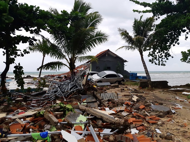A car is seen among ruins after a tsunami hit Carita beach in Pandeglang, Banten province, Indonesia, December 23, 2018. REUTERS/Adi Kurniawan