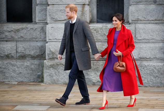 Prince Harry and Meghan, Duchess of Sussex walk during their visit in Birkenhead, Britain January 14, 2019. REUTERS/Carl Recine