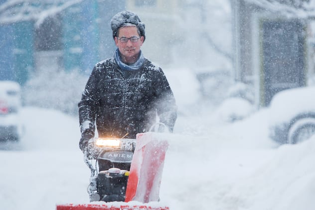 Man blows snow during a winter storm in Buffalo, New York, U.S., January 30, 2019. REUTERS/Lindsay Dedario - RC1C97EE3820