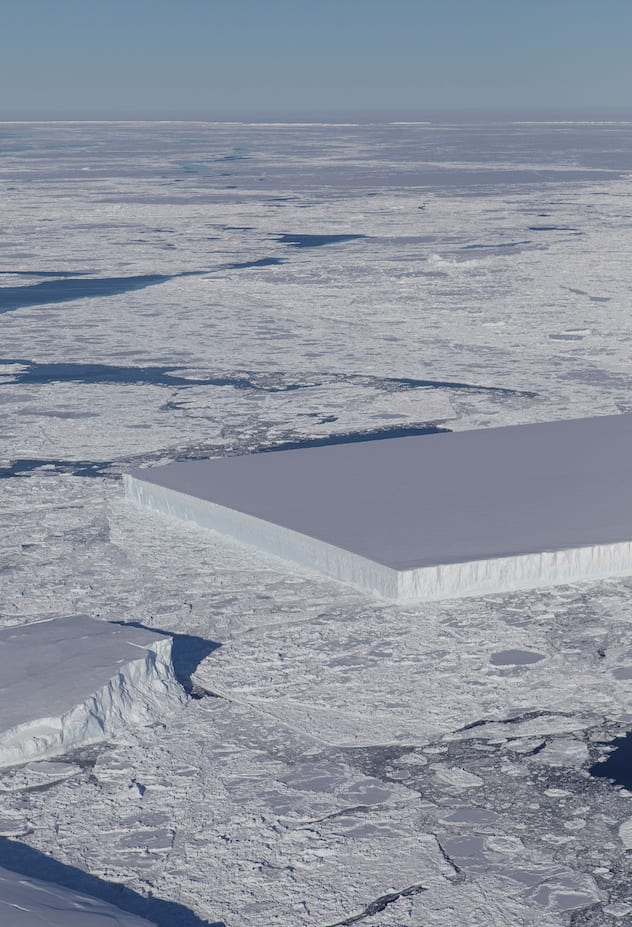 A sharp-angled, tabular iceberg floats among sea ice just off of the Larsen C ice shelf in the northern Antarctic Peninsula, October 16, 2018.   Picture taken October 16, 2018.   NASA/Jeremy Harbeck/Handout via REUTERS     ATTENTION EDITORS - THIS IMAGE WAS PROVIDED BY A THIRD PARTY. - RC18A8A43E50