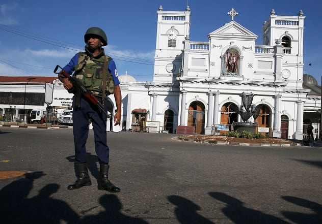 A security officer stands in front of St Anthony's shrine in Colombo, after bomb blasts ripped through churches and luxury hotels on Easter, in Sri Lanka April 22, 2019. Photo Credit: REUTERS/Athit Perawongmetha