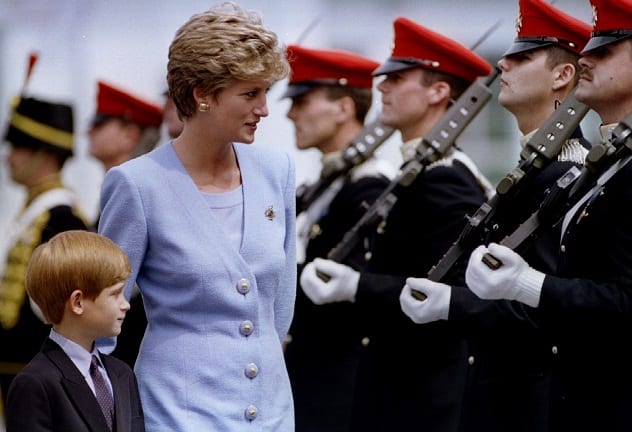Princess of Wales, Lady Diana, inspects with her eight-year-old son, Prince Harry, troops at the regiment's base of Bergen-Hohne, July 29. The soldiers of the "Light Dragoons" are an armoured reconnaissance regiment - PBEAHUNJSFR