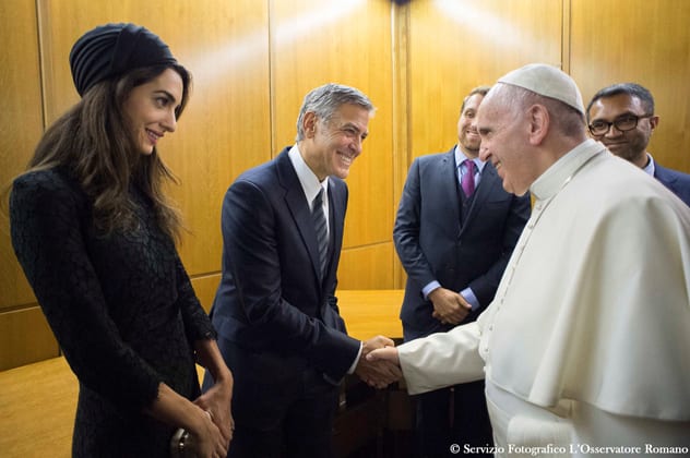 An audience with the Pope: Amal and George met Pope Francis during a meeting of the Scholas Occurrentes at the Vatican in May 2016. REUTERS