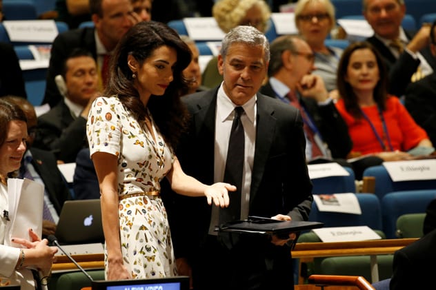 Shared interests: Amal invites her husband to the United Nations Refugee Summit in September 2016. REUTERS