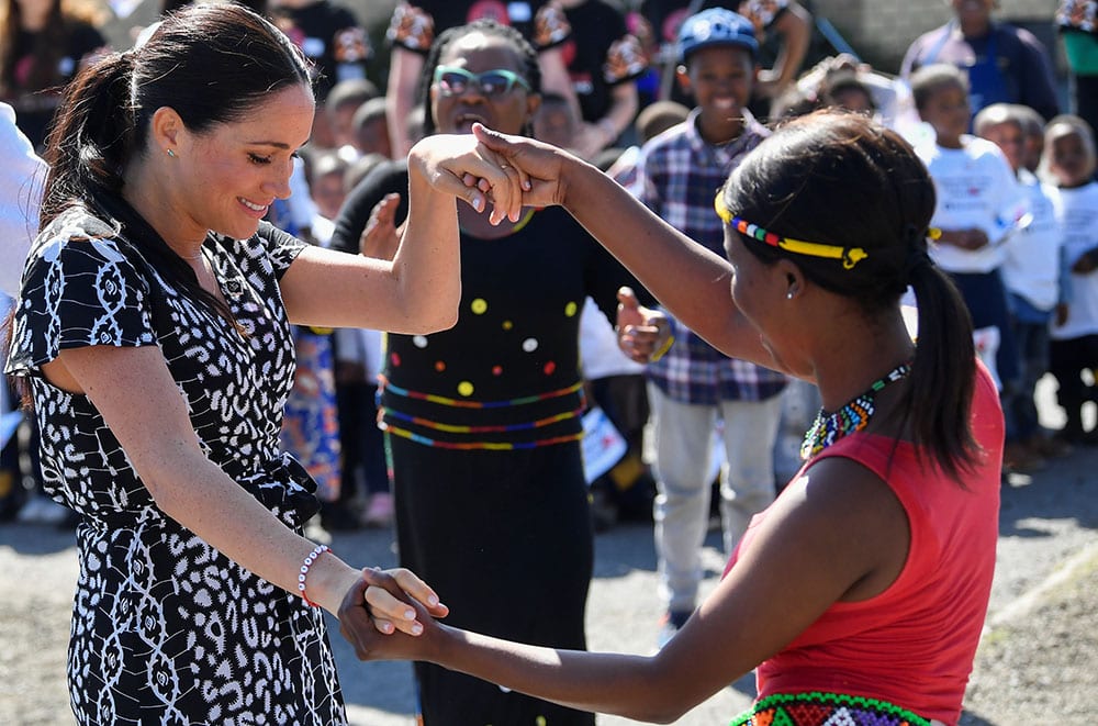Meghan delighted crowds by joining in with cultural a performance during the recent tour of South Africa. REUTERS