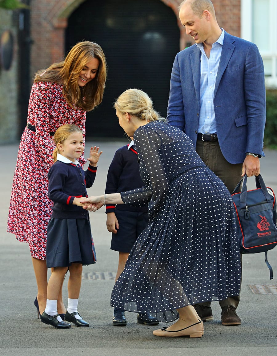 Helen Haslem, the head of the school greets Britain's Princess Charlotte as she arrives for her first day of school accompanied by her mother Catherine, Duchess of Cambridge, father Prince William, Duke of Cambridge (not pictured) and brother Prince George (not pictured), at Thomas's Battersea in London, Britain September 5, 2019. Aaron Chown/Pool via REUTERS - RC14E731FEE0