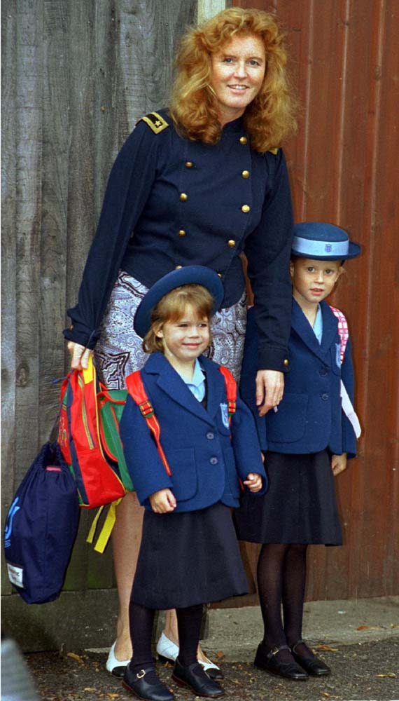The Duchess of York delivers her four-year-old daughter Princess Eugenie (L) on her first day of school at Upton Hall, near Windsor Castle September 7. Eugenie joins her sister Princess Beatrice (R) aged six at the school - PBEAHUNHQCL