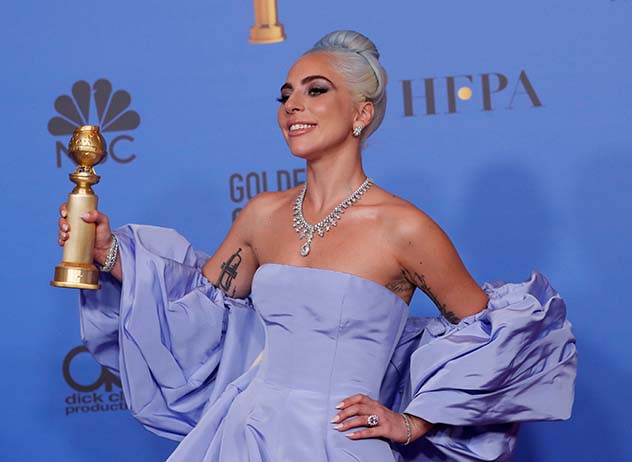  Lady Gaga poses backstage with her Golden Globe for Best Original Song. Image: REUTERS/Mario Anzuoni 