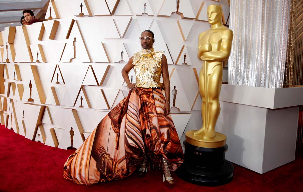 Billy Porter in Giles Deacon and shoes by Jimmy Choo poses on the red carpet during the Oscars arrivals at the 92nd Academy Awards in Hollywood, Los Angeles, California, U.S., February 9, 2020. REUTERS/Mike Blake     TPX IMAGES OF THE DAY - HP1EG291NRGVK