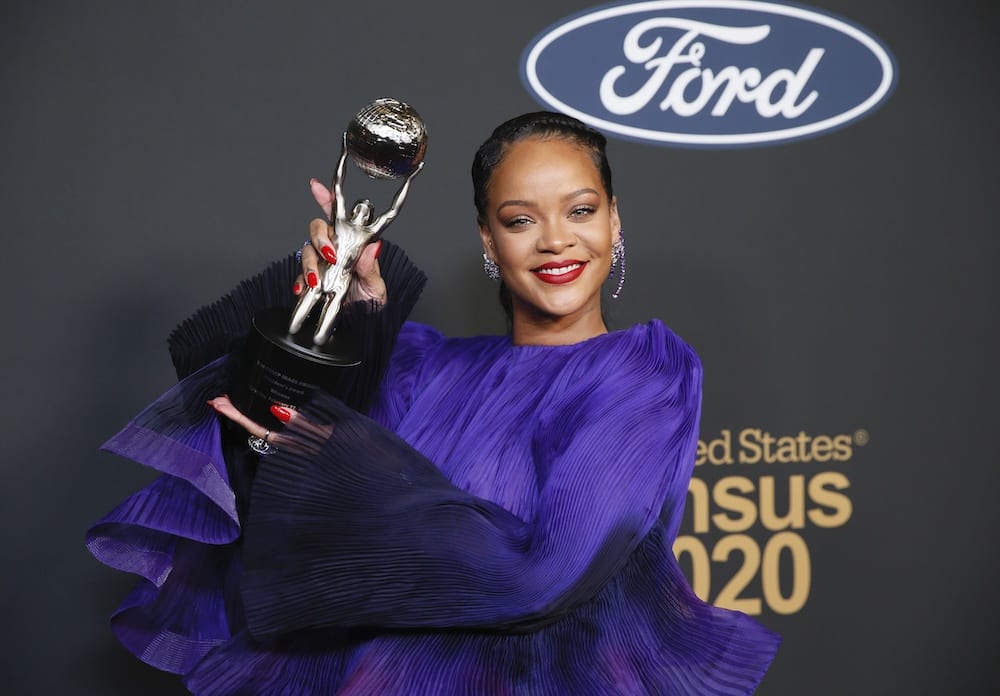Rihanna poses backstage with her President's Award. REUTERS/Danny Moloshok A