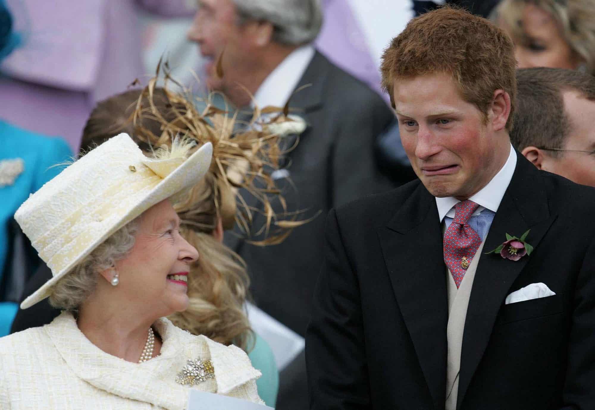 Britain's Queen Elizaberth II smiles as Prince Harry pulls a face as they watch Prince Charles and Camilla, Duchess of Cornwall leave St. George's Chapel. 2005