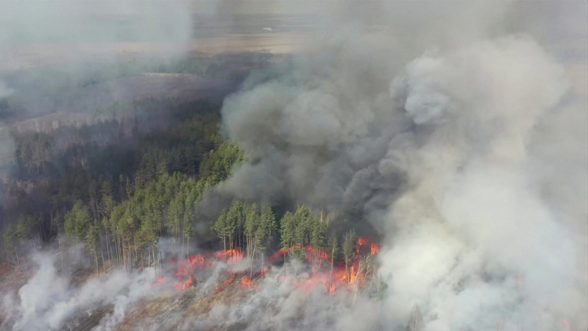 An aerial view shows a forest fire in the 30 km exclusion zone around the Chernobyl nuclear power plant, Ukraine, April 12, 2020, in this still picture taken from video. Video taken April 12, 2020. Reuters TV/via REUTERS