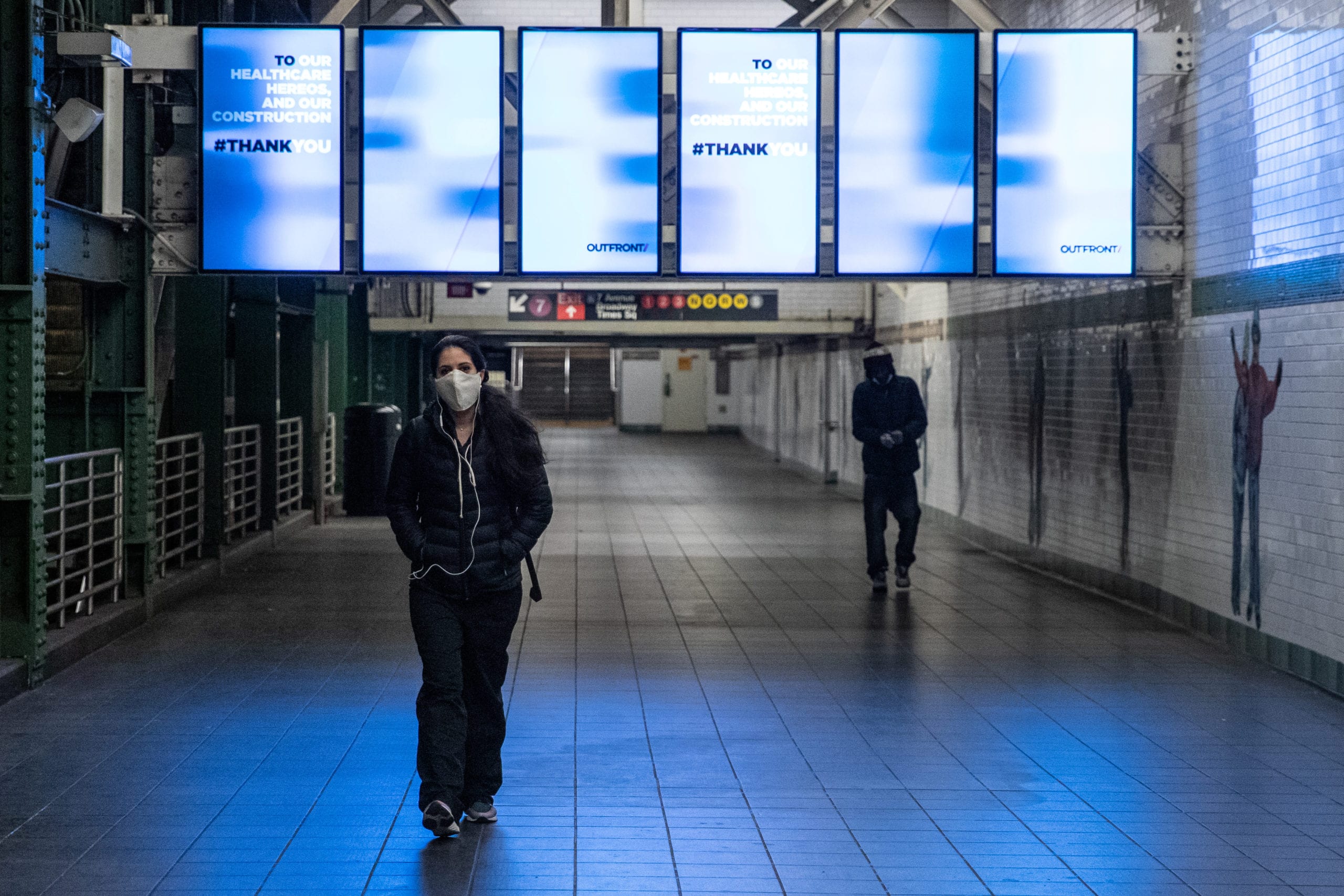 A woman wearing a face mask is seen in the Times Square subway station during the outbreak of the coronavirus disease (COVID-19) in New York City, U.S., April 17, 2020. REUTERS/Jeenah Moon - RC2M6G9N9GJN
