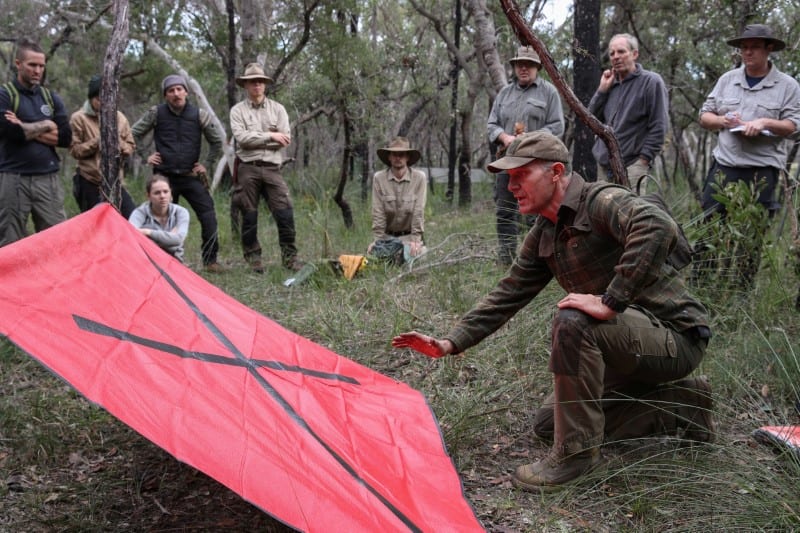 Wilderness survival instructor Gordon Dedman teaches students about signalling for rescue during a basic skills course, which has seen an increase in demand since the coronavirus disease (COVID-19) outbreak, in the Ingleside suburb of northern Sydney, Australia, May 31, 2020. Picture taken May 31, 2020.  REUTERS/Loren Elliott