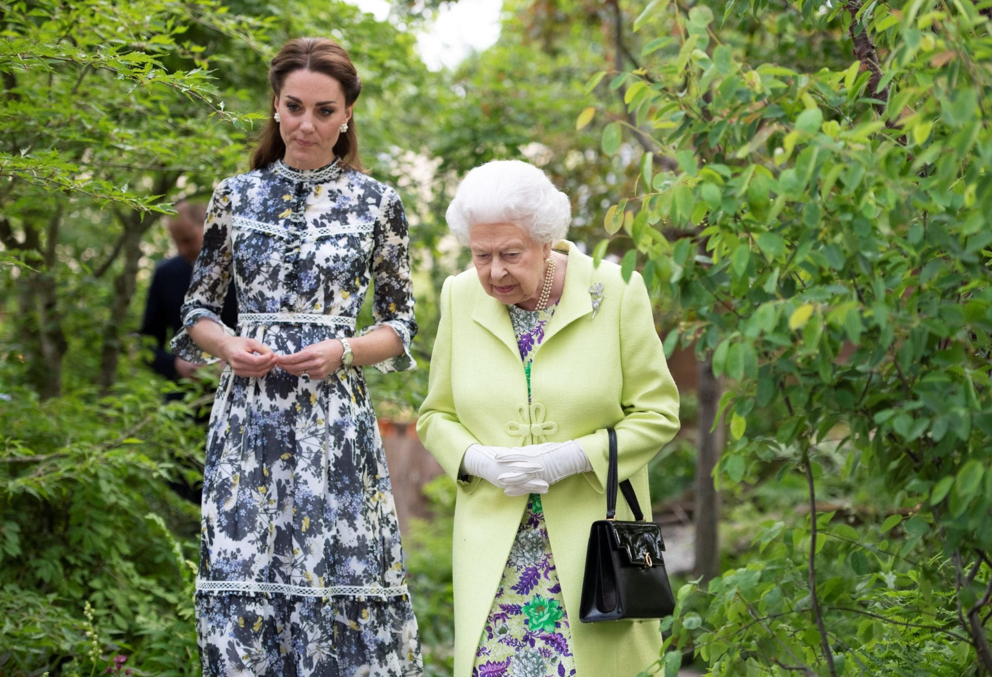 Britain's Queen Elizabeth II is shown around 'Back to Nature' by the designer, Catherine Duchess of Cambridge at the Chelsea Flower Show in London, Britain May 20, 2019. Geoff Pugh/Pool via REUTERS - RC14E7254F60