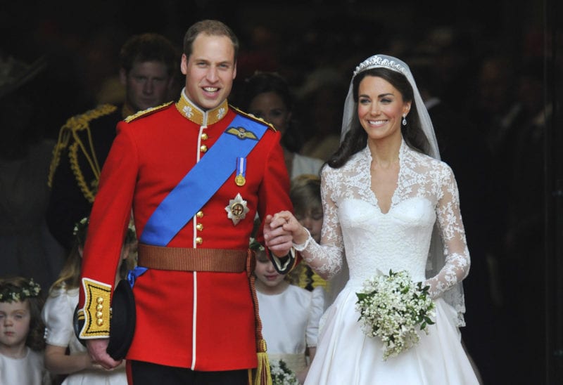 Britain's Prince William and Catherine, now the Princess of Wales,  following their wedding ceremony in Westminster Abbey, 29 April 2011. Catherine's wedding dress was designed by Sarah Burton.