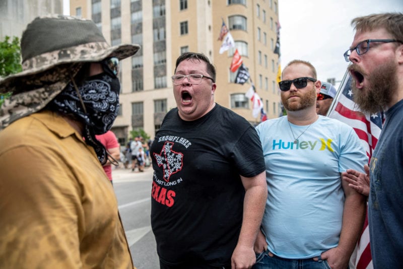 People protest against mandates to wear masks amid the coronavirus disease (COVID-19) outbreak in Austin, Texas, U.S., June 28, 2020. REUTERS/Sergio Flores     TPX IMAGES OF THE DAY
