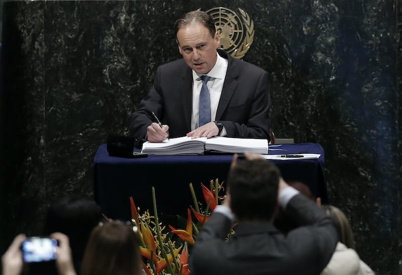 FILE PHOTO: Australian Minister of Environment Greg Hunt signs the Paris Agreement on climate change held at the United Nations Headquarters in Manhattan, New York, U.S., April 22, 2016.  REUTERS/Mike Segar