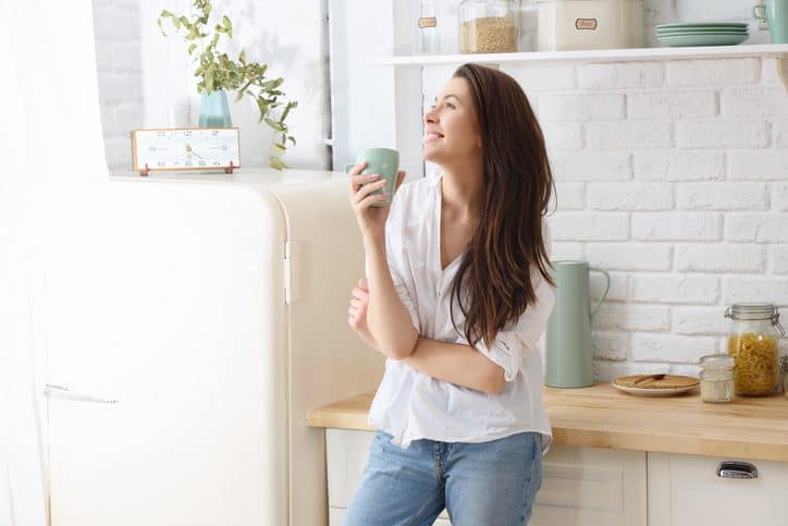 Drinking ginger tea in the kitchen