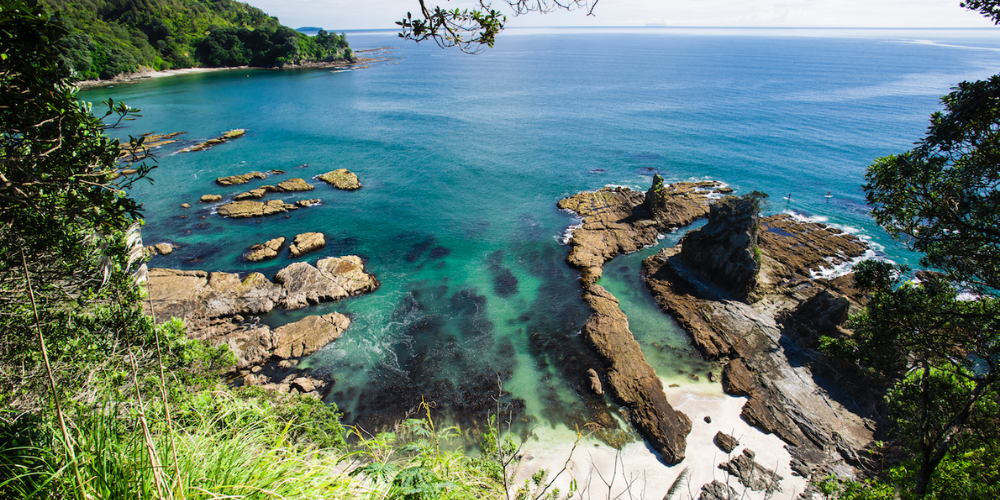 Take a dip at these 6 secluded beaches and waterfalls in the North Island