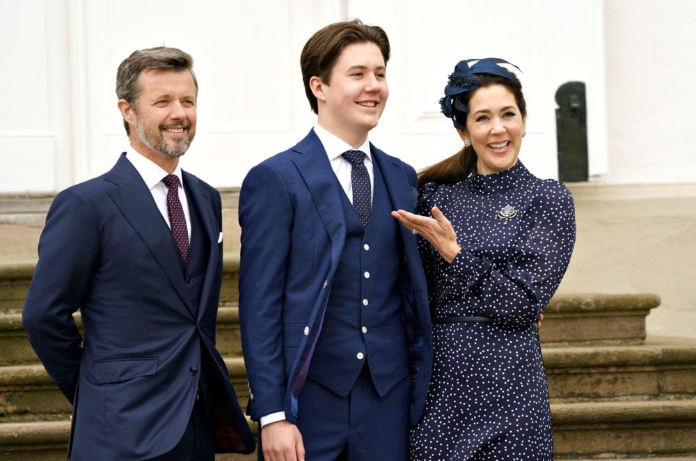 Danish Prince Christian stands with Crown Prince Frederik and Crown Princess Mary after his confirmation ceremony at Fredensborg Castle Church, Denmark May 15, 2021. 