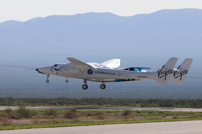 Virgin Galactic's passenger rocket plane VSS Unity, borne by twin-fuselage carrier jet dubbed VMS Eve, takes off with billionaire entrepreneur Richard Branson and his crew for travel to the edge of space at Spaceport America near Truth or Consequences, New Mexico, U.S., July 11, 2021. REUTERS/Joe Skipper