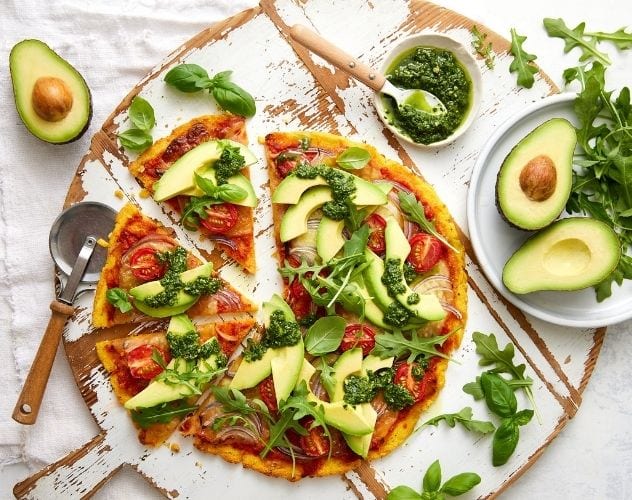 Herb Crusted Polenta Pizza Base Topped with Avocado and Pesto