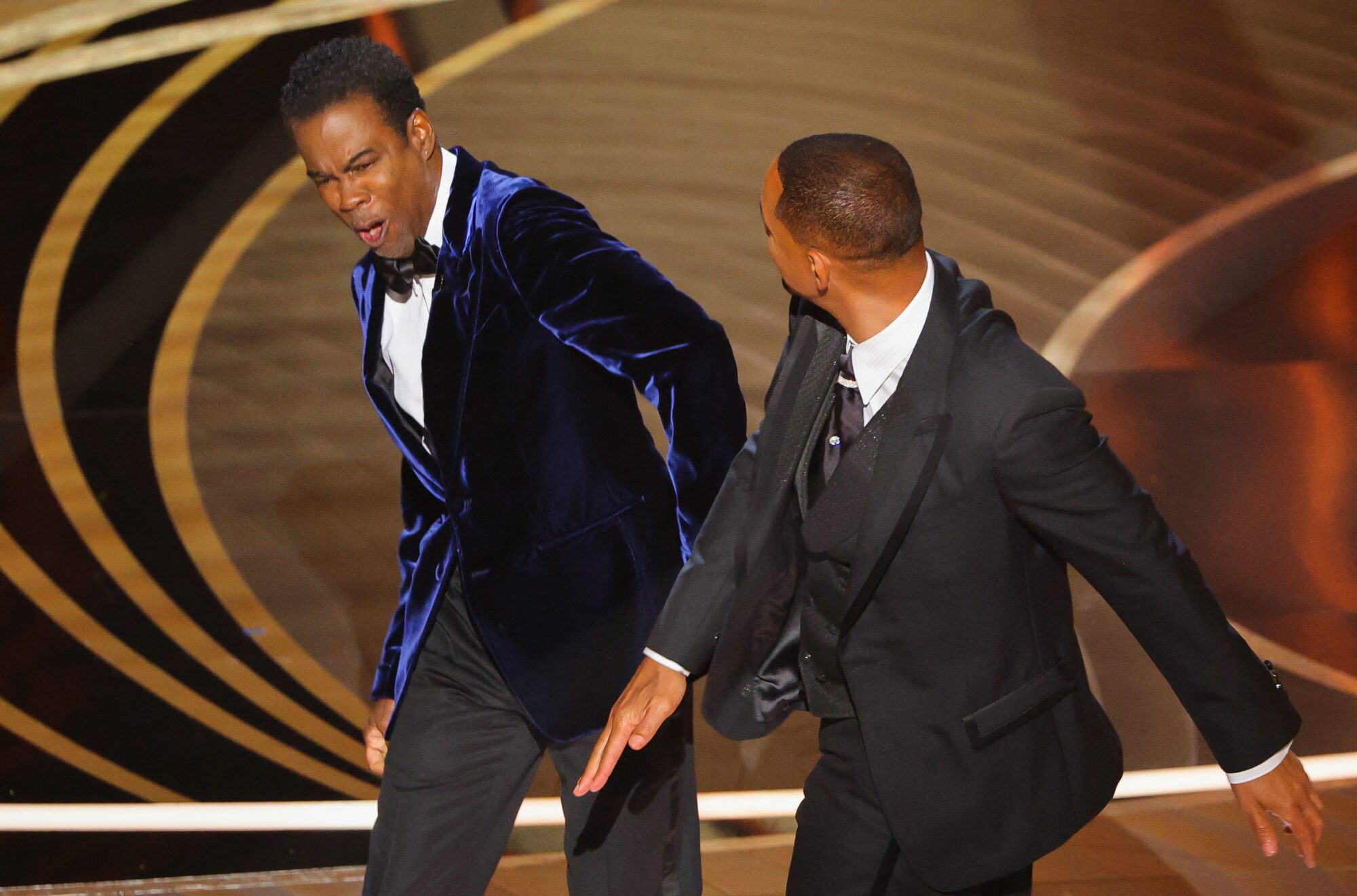 Will Smith hits Chris Rock as Rock spoke on stage during the 94th Academy Awards in Hollywood, Los Angeles, California, U.S., March 27, 2022. REUTERS/Brian Snyder