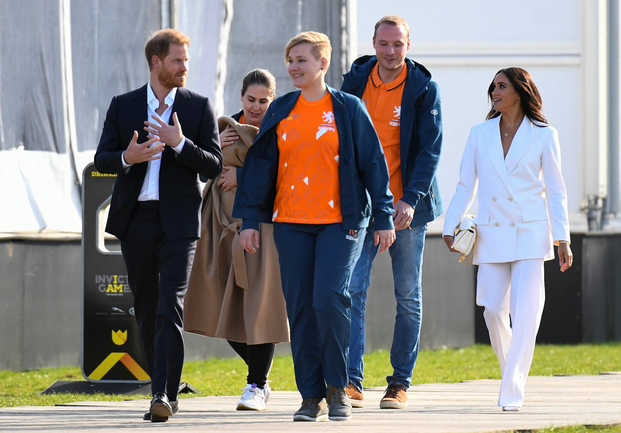 Prince Harry and Meghan, Duchess of Sussex, arrive at the yellow carpet of the Invictus Games to attend the friends and family reception in The Hague, Netherlands April 15, 2022. REUTERS/Piroschka Van De Wouw