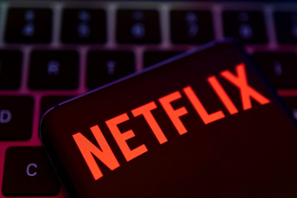 Smartphone with Netflix logo is placed on a keyboard in this illustration taken April 19, 2022. REUTERS/Dado Ruvic