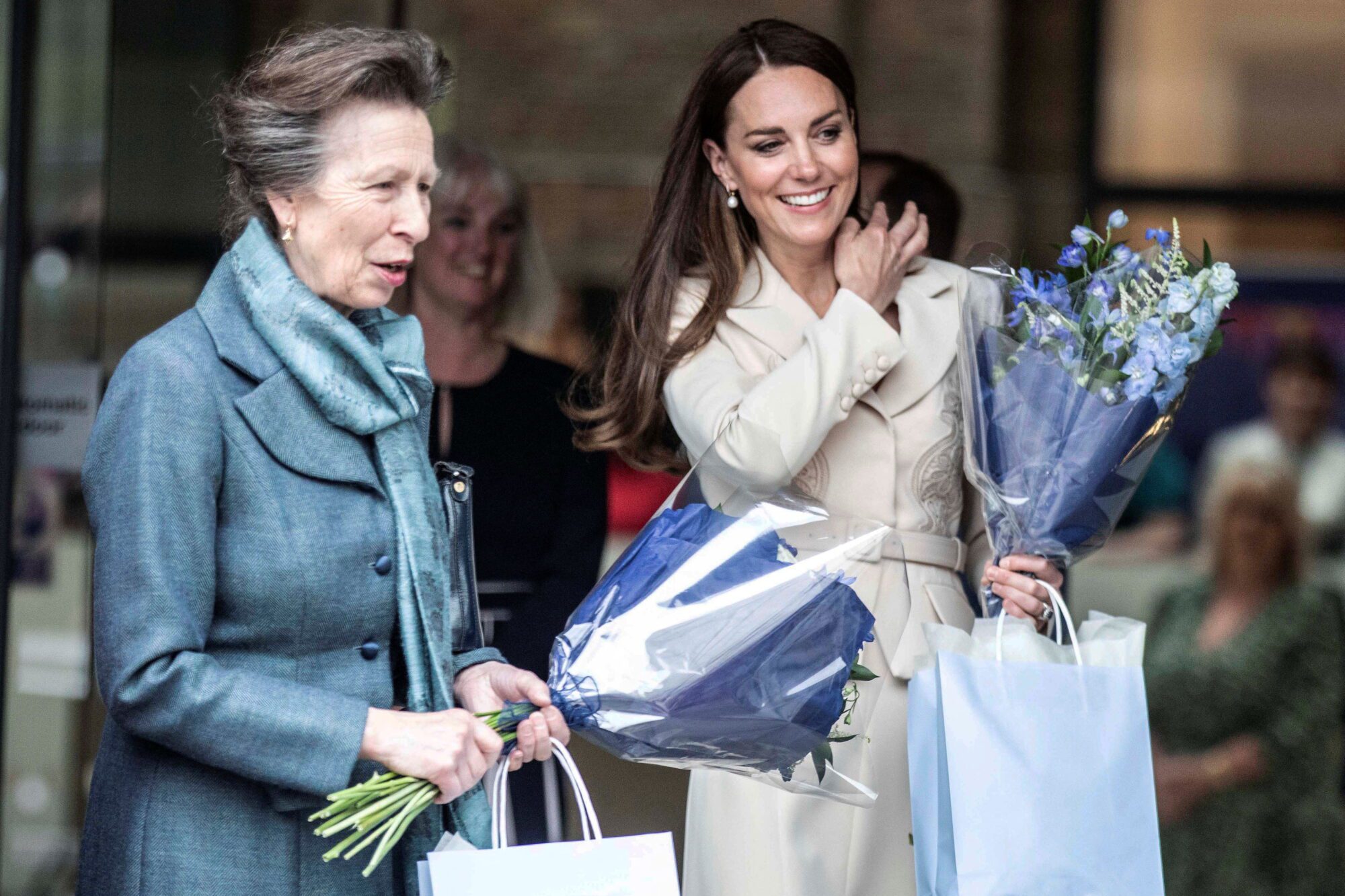 Britain's Anne, Princess Royal and Catherine, Duchess of Cambridge receive flowers after visiting the Royal College of Midwives and Royal College of Obstetricians and Gynaecologists (RCM, RCOG) headquarters in London, Britain, April 27, 2022. The Princess Royal is a patron of RCM. Richard Pohle/Pool via REUTERS