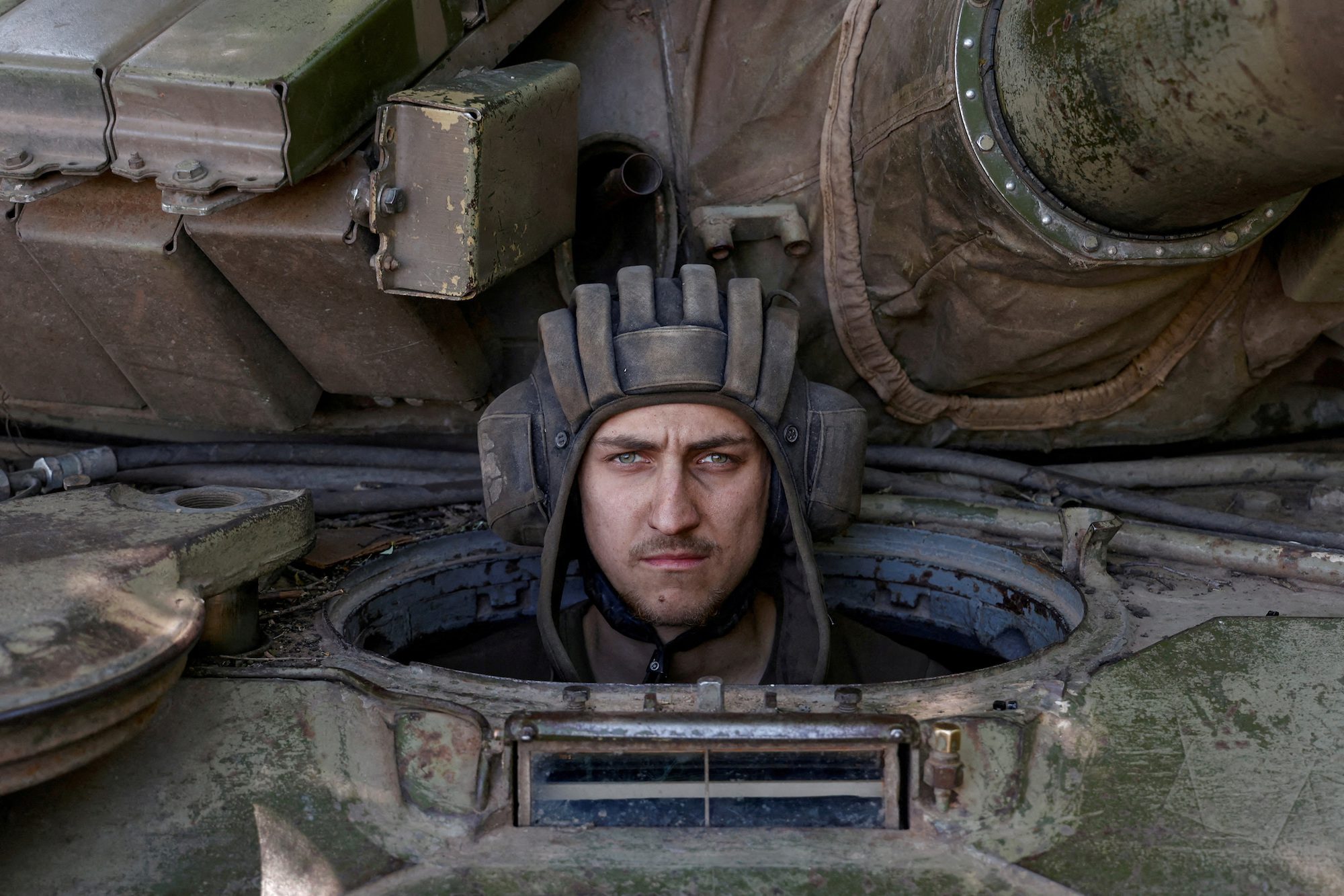 A Ukrainian serviceman looks on from inside a tank at a position in Donetsk region, as Russia's attack on Ukraine continues, June 11, 2022.        REUTERS/Stringer