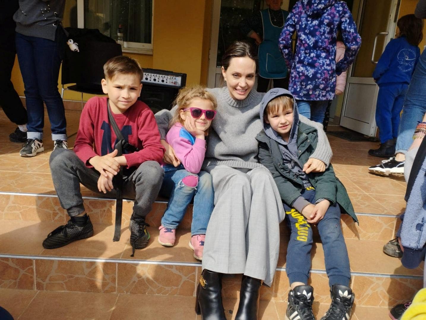 U.S. actor and UNHCR Special Envoy Angelina Jolie poses for a picture with children, as Russia's attack on Ukraine continues, in Lviv, Ukraine April 30, 2022.