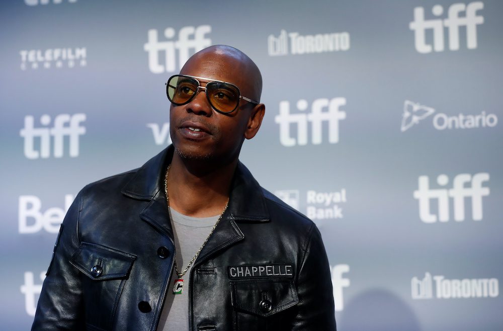 FILE PHOTO: Actor Dave Chappelle arrives for the press conference to promote the film A Star is Born at the Toronto International Film Festival (TIFF) in Toronto, Ontario, Canada, September 9, 2018.  REUTERS/Mario Anzuoni