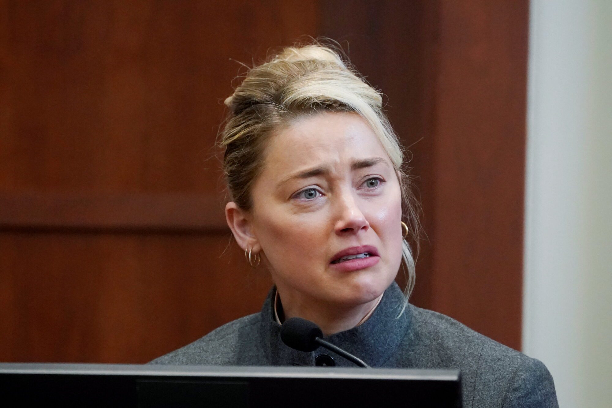 Actor Amber Heard testifies in the courtroom at the Fairfax County Circuit Courthouse in Fairfax, Va., Monday, May 16, 2022.  Steve Helber/Pool via REUTERS