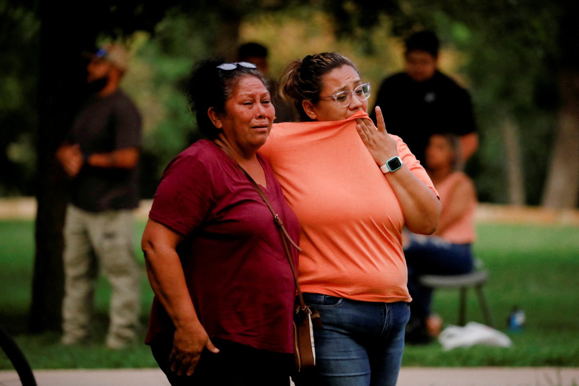 People react outside the Ssgt Willie de Leon Civic Center, where students had been transported from Robb Elementary School after a shooting, in Uvalde, Texas, U.S. May 24, 2022. REUTERS/Marco Bello