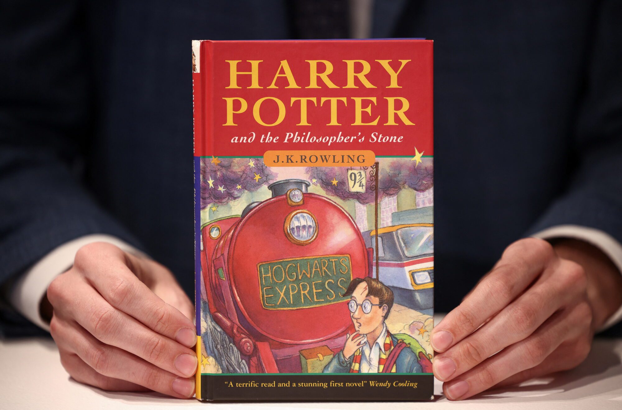 A rare first edition and signed by the author copy of 'Harry Potter and the Philosophers Stone' by British author J.K. Rowling, which is to be put up for auction at Christie's auction house in London, Britain May 31, 2022. REUTERS/Henry Nicholls