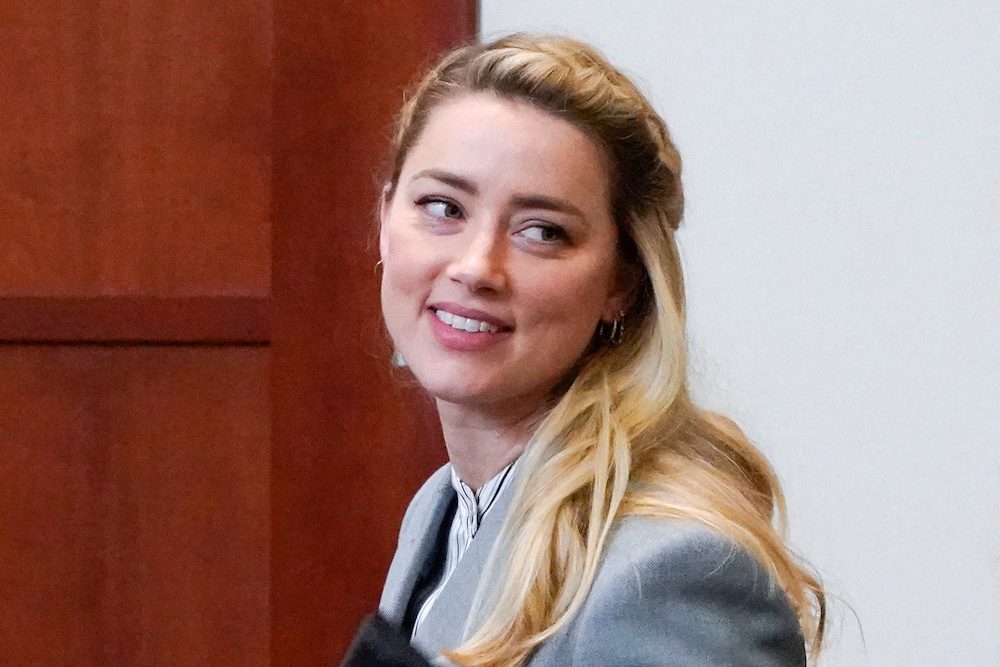 FILE PHOTO: Actor Amber Heard leaves during a break in the courtroom during closing arguments during her ex-husband Johnny Depp's defamation case against her at the Fairfax County Circuit Courthouse in Fairfax, Virginia, U.S., May 27, 2022. Steve Helber/Pool via REUTERS